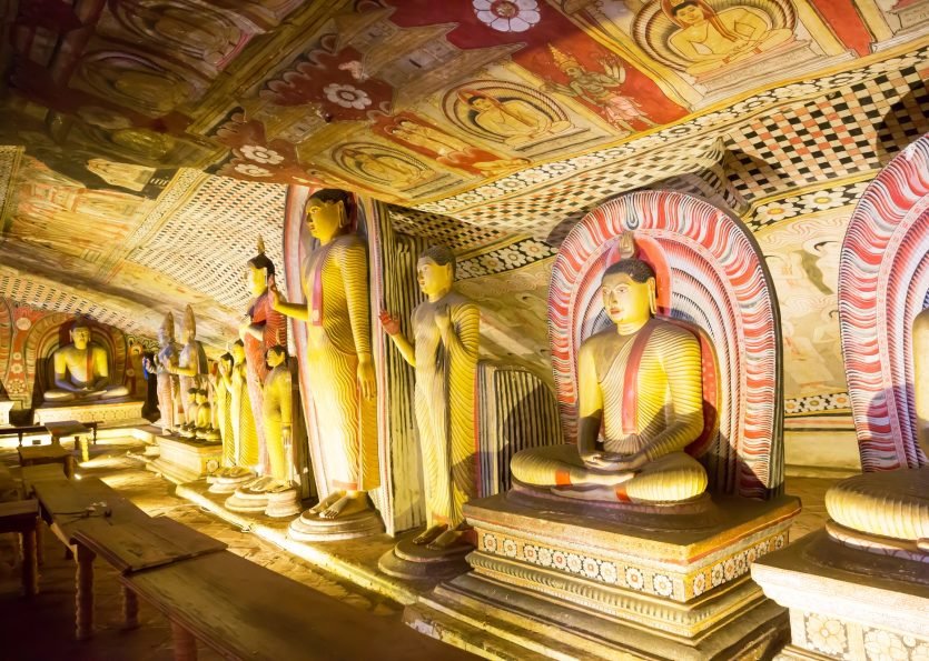 Ancient golden statues in buddha temple on Ceylon