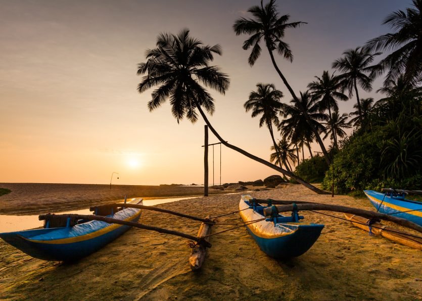 Fishing boat on the beach at sunset. Sri Lanka